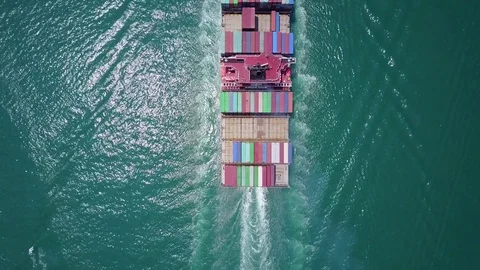 Look at sailing container ship from above, vessel move away Stock Footage 75995740