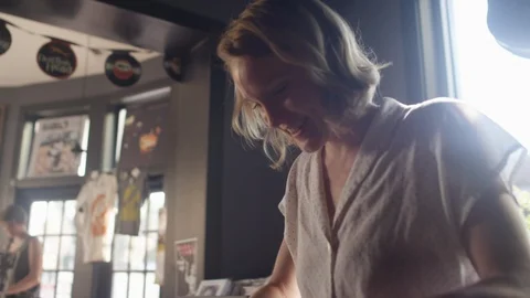 Look through a box of vinyl records and finds a record to take to the counter Video stock 122575794