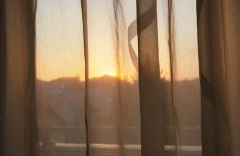 A look through the curtain Stock-Fotos
