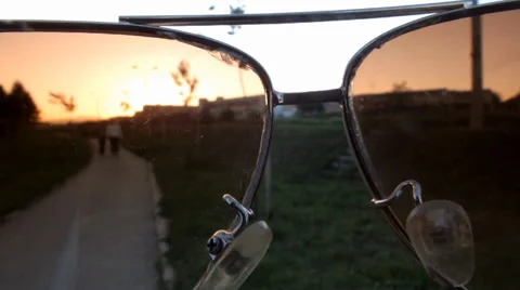 Look through the glasses on the path that people walk around in the last moments 스톡 동영상 37849110
