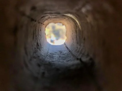 Look through the inside of square brick hole Stock Photos