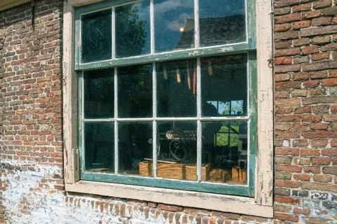 A look through the old window of a brush maker Stock Photos