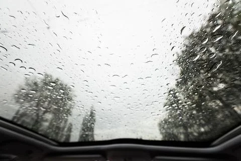Look through windshield from inside the car at rainy weather Stock Photos