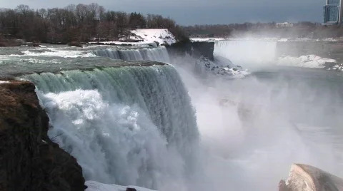 A look from the top of Niagara Falls to the snow and mist in Stock Footage