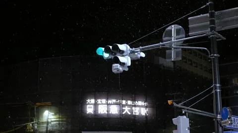 Look up view to street main traffic light while snowing in kyoto city center int Stock Footage 289813541