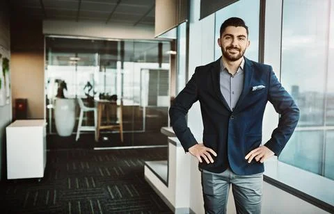 Look where commitment got me. Portrait of a confident young businessman working Foto stock
