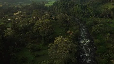 Looking from above, a stream is flowing from the top of the mountain to the s Stock Photos