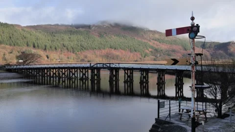 Looking across the Afon Mawddach and Penmaenpool Toll Bridge, North Wales, UK Video stock 293097393