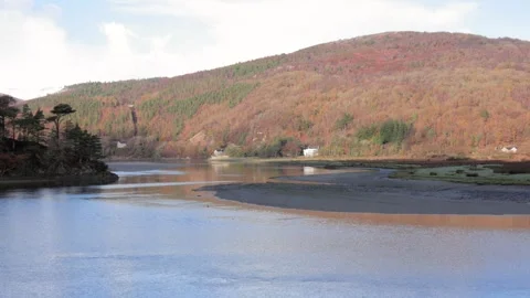 Looking across the Afon Mawddach, in early winter light. North Wales, UK Video stock 293097306