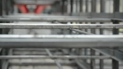 Looking up across a gridwork of industrial fabricated cages 動画素材 22201316