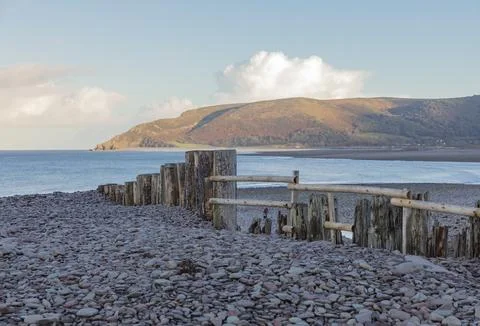Looking across a pebble beach Stock Photos