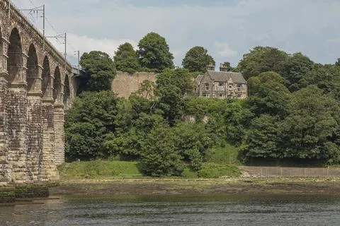 Looking across the river tweed parallel with the railway viaduct Stock Photos