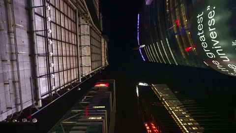 Looking up advertisement billboards in Time Square New York City NYC at night 4k Stock Footage 164568647