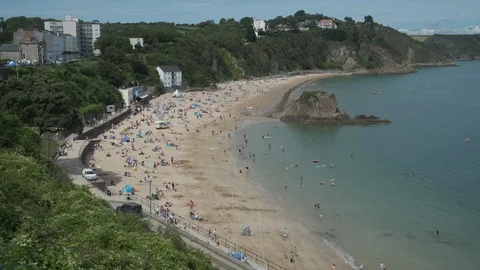 Looking along the sandy North Beach Tenby Pembrokeshire Stock Footage 114359230