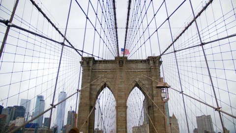 Looking up at The American Flag Flying On the Brooklyn Bridge, Brooklyn, USA  Stock Footage 109369170
