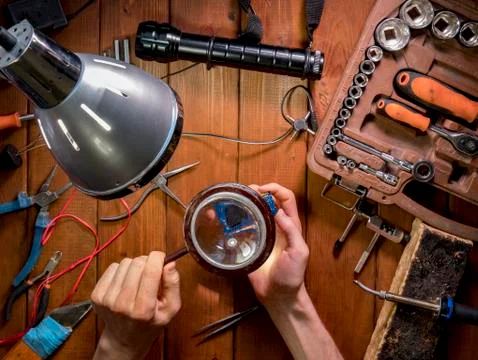 Looking and learning and examining the electric board in the workshop over th Stock Photos