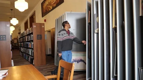 Looking at artwork Video stock 171340693