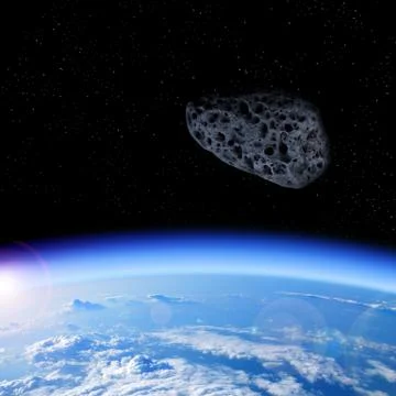 Looking at the asteroid approaching from space to Earth Stock Photos