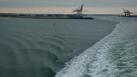 Looking back on the board of a ferry leaving the harbor of Dunkirk port Stock Footage 102532561