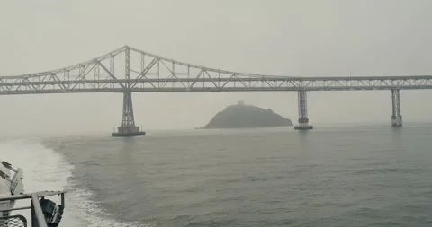 Looking back on a boat at the richmond bridge the bay area Stock Footage 262686459