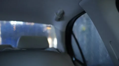 Looking in back of interior car at a car wash Stock Footage 64679519