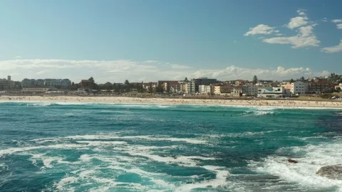 Looking back over Bondi Beach and the Bondi Beach Pavillion Stock Footage 102352279