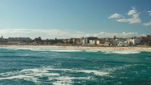 Looking back over Bondi Beach and the Bondi Beach Pavillion Stock Footage 102472787