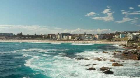 Looking back over Bondi Beach and the Bondi Beach Pavillion Stock Footage 102476523