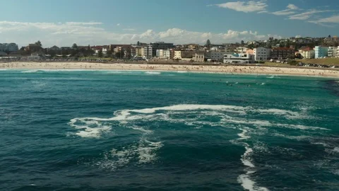 Looking back over Bondi Beach and the Bondi Beach Pavillion Stock Footage 102477602