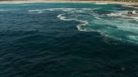 Looking back over Bondi Beach and the Bondi Beach Pavillion Stock Footage 102477713
