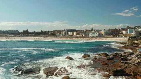 Looking back over Bondi Beach and the Bondi Beach Pavillion Stock Footage 102478330