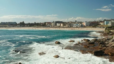 Looking back over Bondi Beach and the Bondi Beach Pavillion Stock Footage 102478487