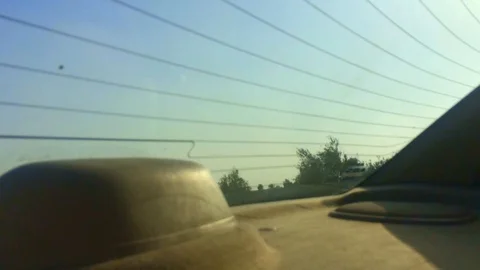 Looking from the back seat window in a car to high way station Video stock 87909312