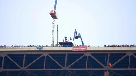 Looking Up At Base Jumpers, Man Jumps and Pulls Parachute, Slow Motion Stock Footage 127469343