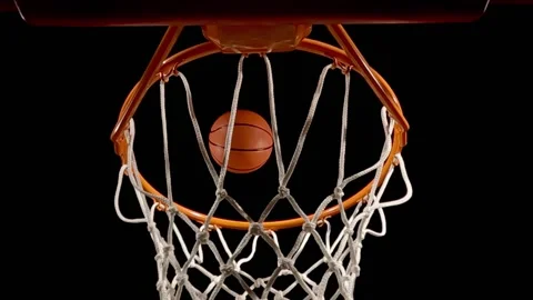 Looking up at a basketball net as a free throw is nothing but net, slow motion Stock Footage 172032574