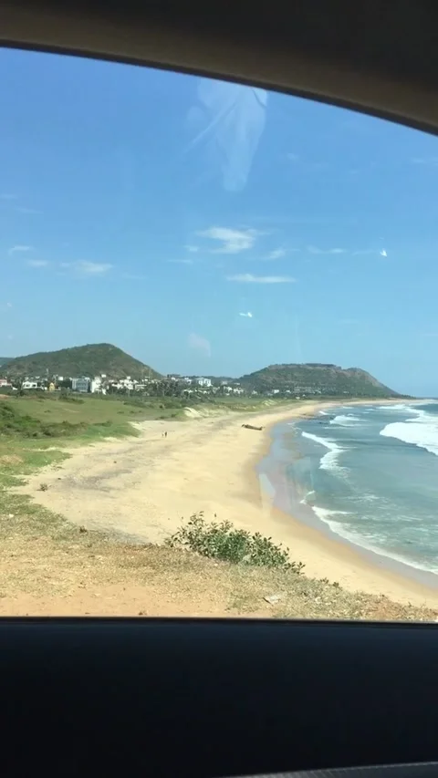 Looking Beach sitting in a car on a cliff Stock Footage 137022245