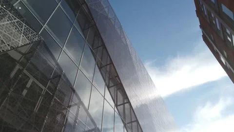 Looking up beautiful reflection glass building passing by 動画素材 131001573