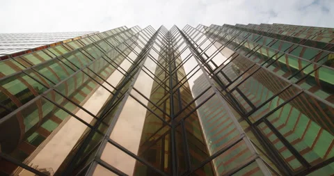 Looking up at Beautifully Designed Glass Skyscraper in Tsim Sha Tsui, Hong Kong Vídeo Stock 282508171