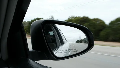 Looking behind car side mirror Video stock 103632466