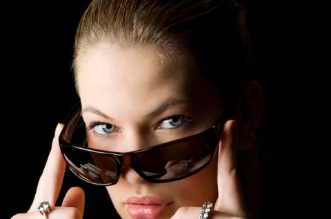 Looking behind sunglasses Stock Photos