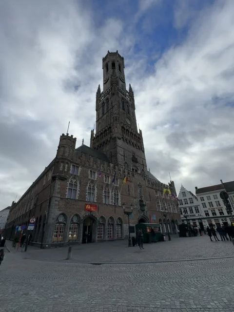 Looking Up at the Belfry in Bruges with Cloudy Sky Stock Footage 306936760