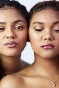Looking better together naturally. Studio shot of two beautiful young women Stock Photos