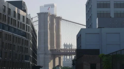 Looking between buildings at The Brooklyn Bridge Stock Footage 278021705