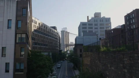 Looking between buildings at The Brooklyn Bridge Stock Footage 278021713