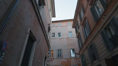 Looking Up Between Historic Buildings in a Narrow Rome Street Stock Footage 338071269