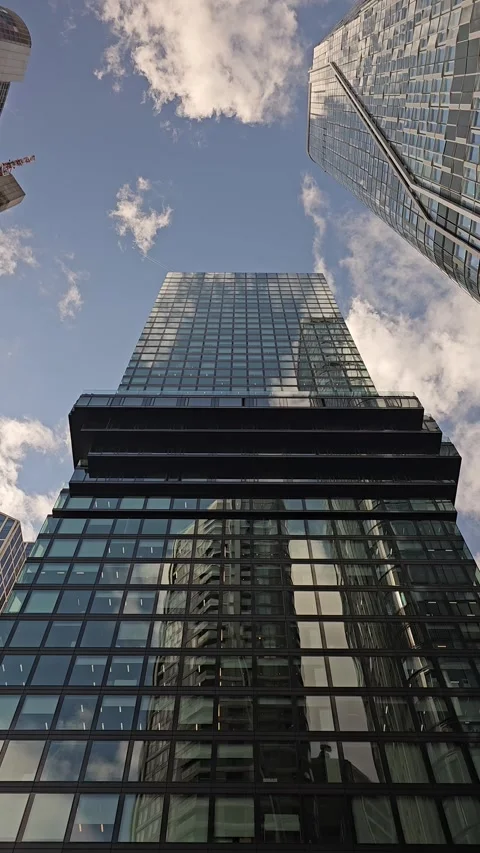 Looking Up Between Modern Skyscrapers Under Blue Sky Stock Footage 344310112