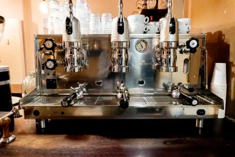 Looking at a big coffee maker in a coffee house Stock Photos