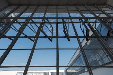 Looking up at big window front with partially opened windows of the Bauhaus i 스톡 사진