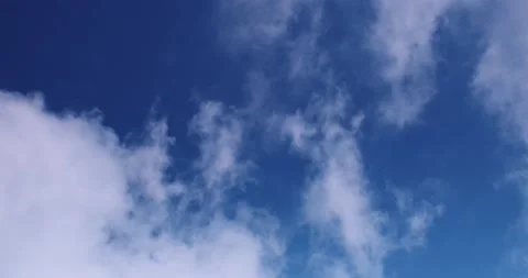 Looking up blue sky and clouds passing overhead Stock Footage 152082222