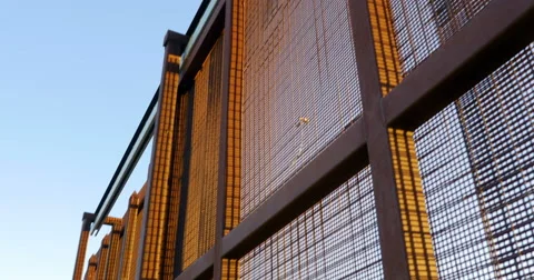 Looking Up at the Border Wall Between Two Countries 動画素材 67652450